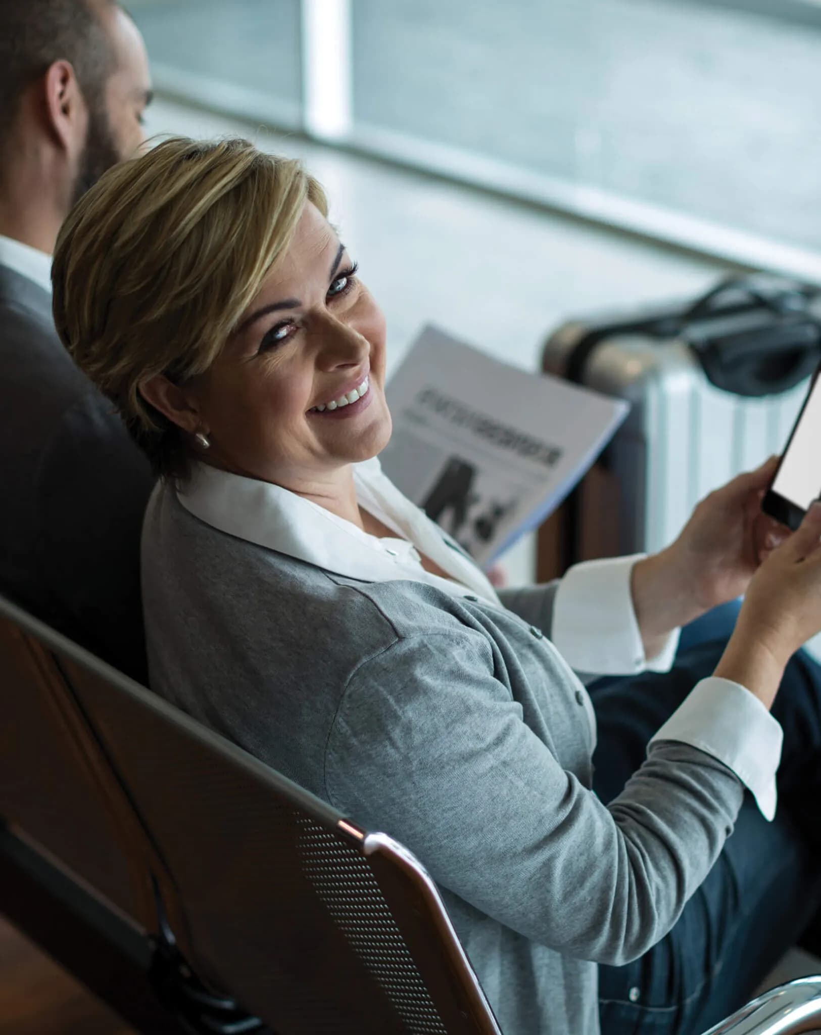 An Adventureora traveler reviewing documents mid-flight