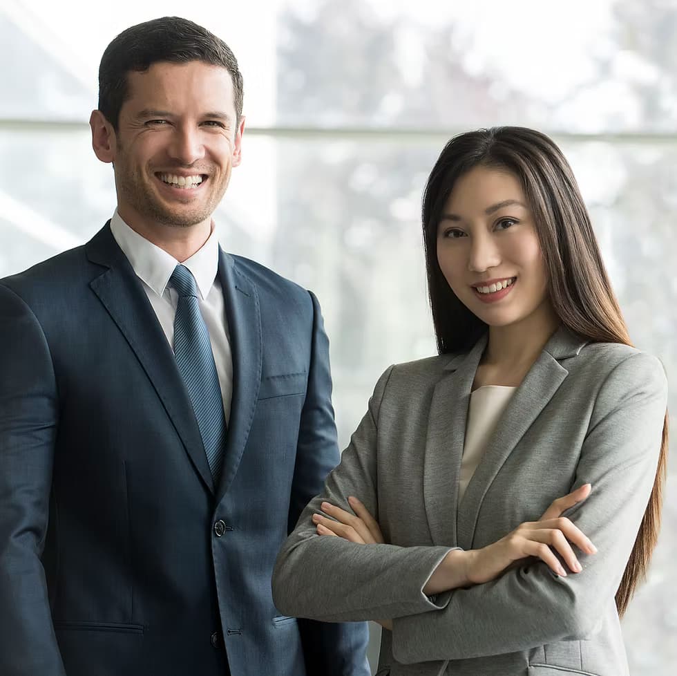 Two Adventureora travel advisors in business attire